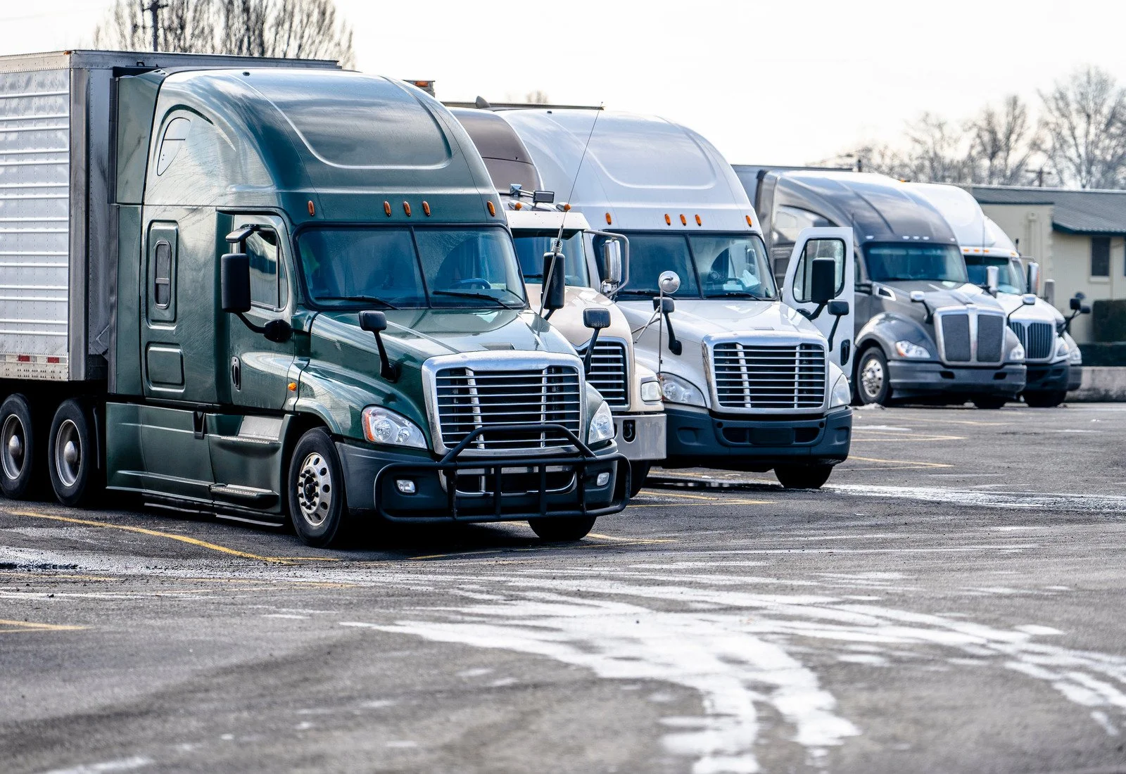 Semi trucks parked in a lot